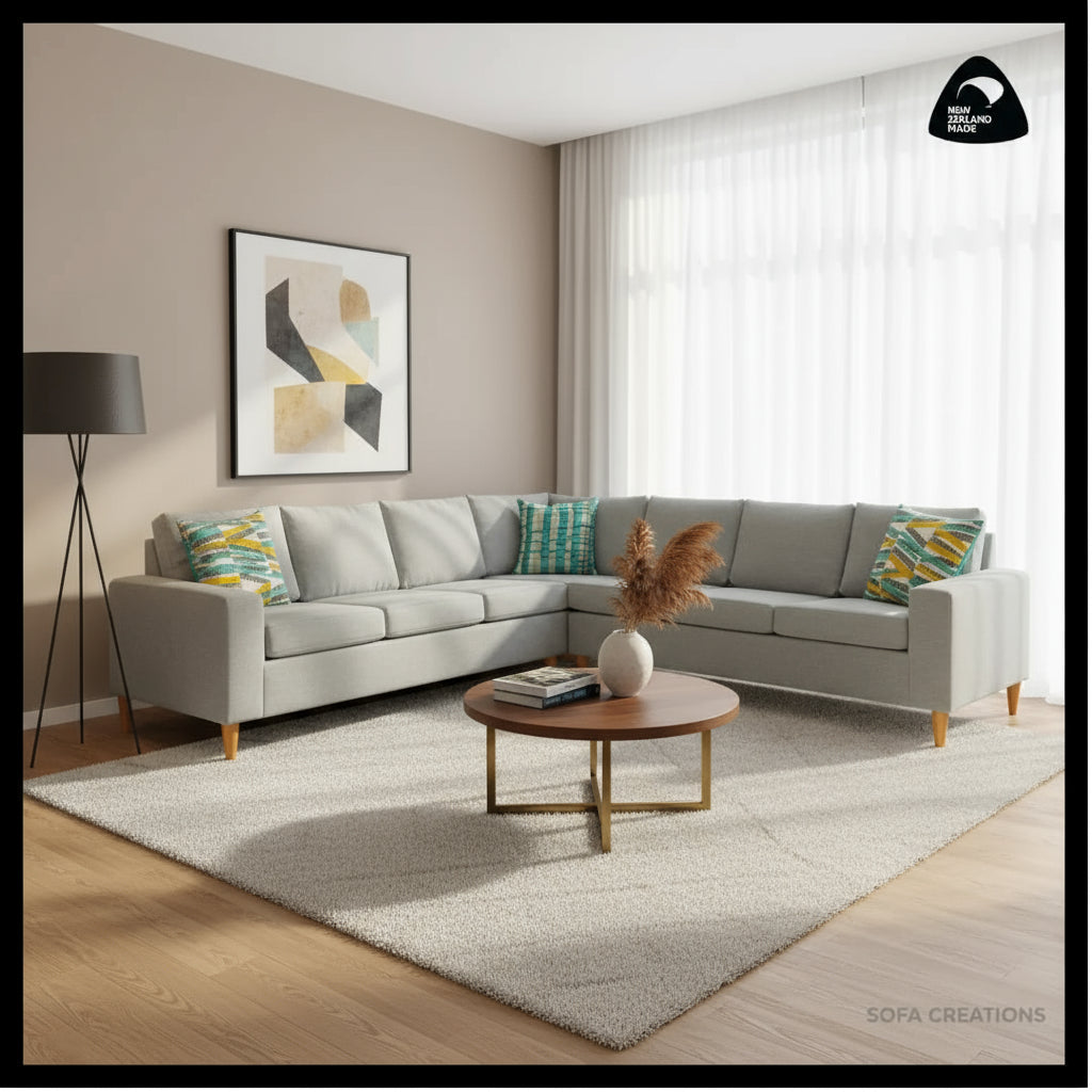 Gray sectional sofa with colorful cushions on a white background, featuring the brand 'Sofa Creations'.