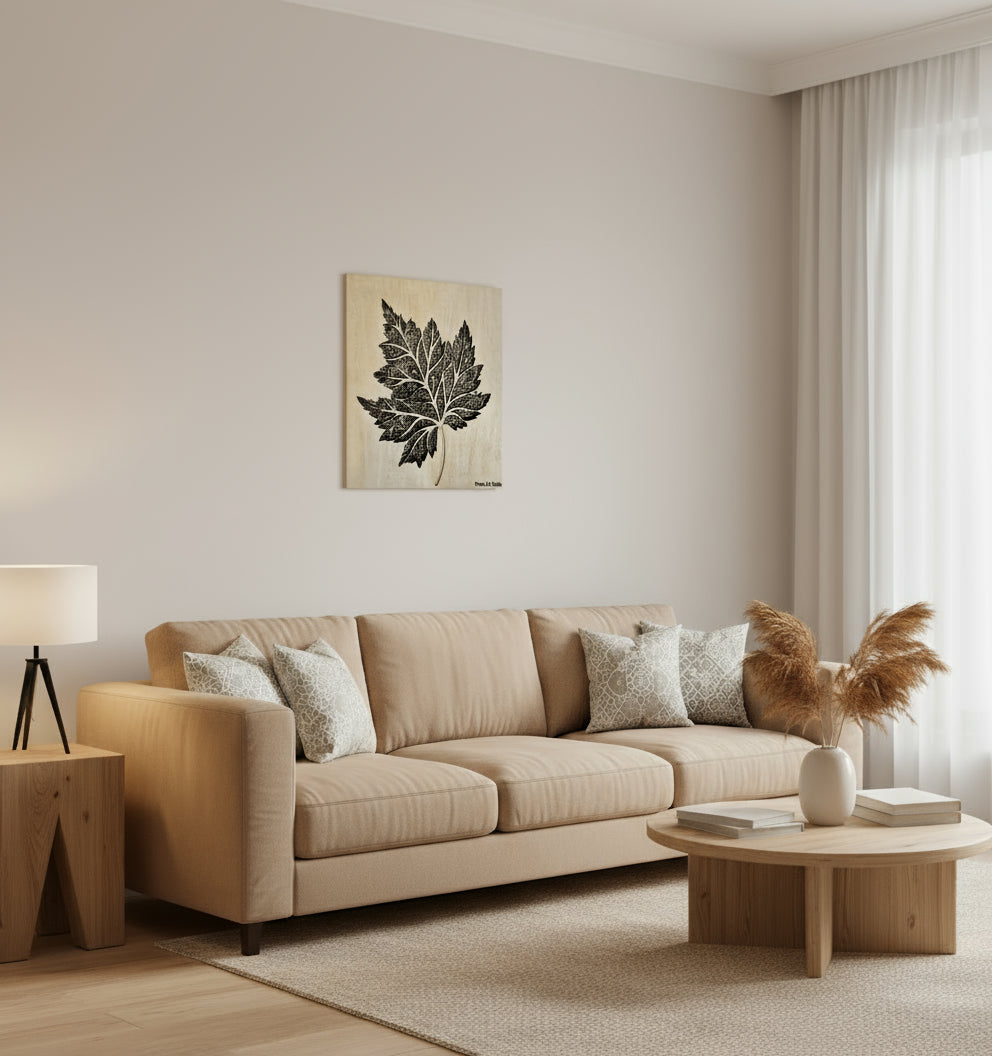 Decorative black leaf design on a beige background