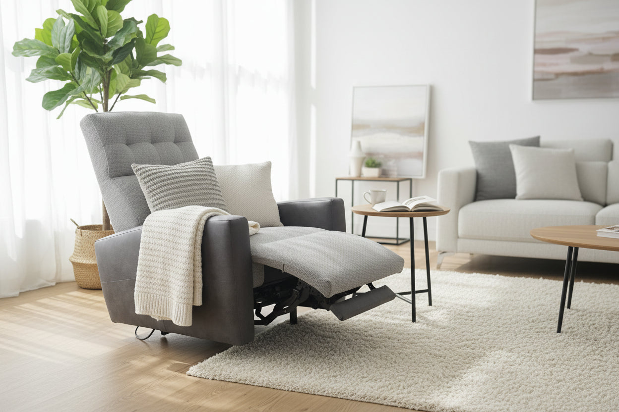 Gray recliner chair in a showroom with other furniture and decor.