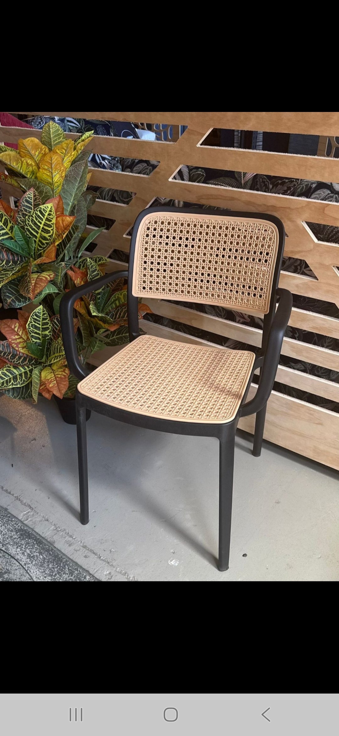 Black and Rattan Chairs -